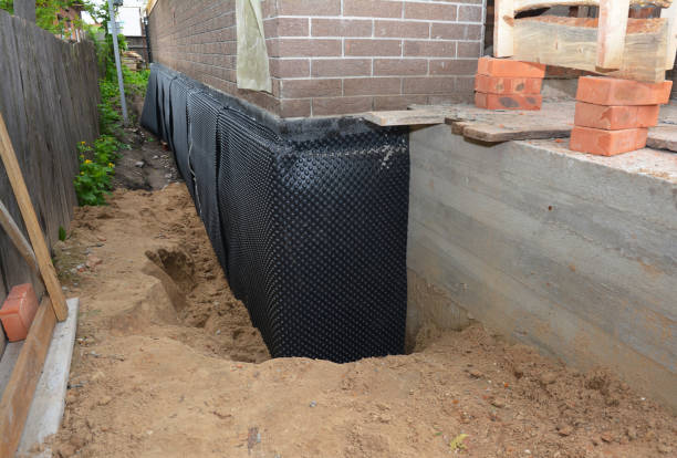 SJ Waterproofing Pros technician performing targeted Emergency Waterproofing assessment in Paoli, IN